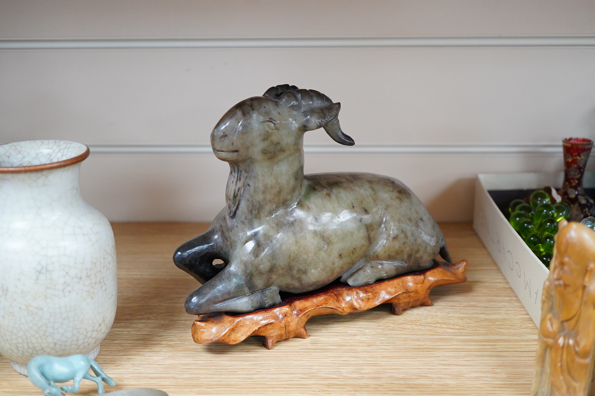 A group of Chinese collectables to include a soapstone carving of a ram, crackle glaze vase and figures of elders, largest 23cm wide